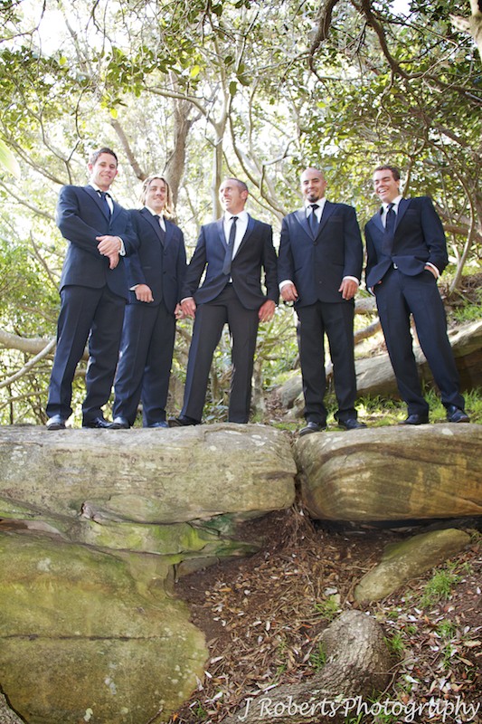 Groom laughing with groomsmen - wedding photography sydney